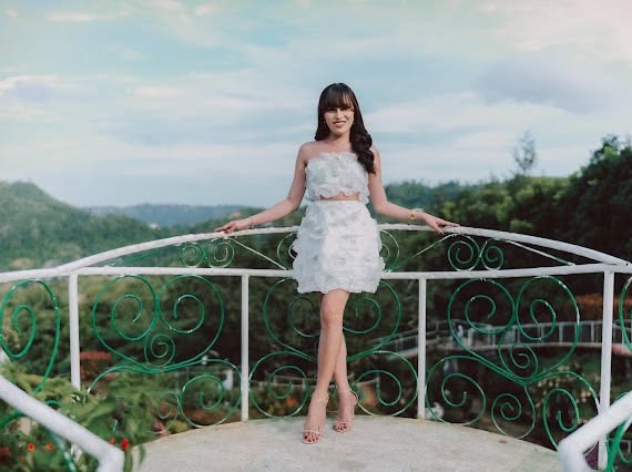 The balcony at the venue, overlooking green hills